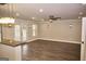 Open living room with hardwood floors, recessed lighting, and French doors at 65 Lotus Ln, Covington, GA 30016