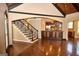 Open-concept living area with staircase and kitchen view, ideal for gatherings at 65 Lotus Ln, Covington, GA 30016