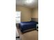 Bedroom features neutral walls, plush carpet, large window, and matching furniture set at 128 Astilbe Meadow Dr, Locust Grove, GA 30248