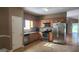 Well-equipped kitchen showcasing stainless steel appliances, and light wood cabinets at 128 Astilbe Meadow Dr, Locust Grove, GA 30248