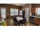 Inviting kitchen featuring dining area, stainless steel appliances, and ample cabinet space at 128 Astilbe Meadow Dr, Locust Grove, GA 30248