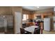 Charming eat-in kitchen boasting stainless appliances, wood cabinets, and ample counter space at 128 Astilbe Meadow Dr, Locust Grove, GA 30248