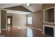 Open living room boasting hardwood floors, vaulted ceilings, and a decorative fireplace at 128 Astilbe Meadow Dr, Locust Grove, GA 30248