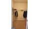 Neutral walk-in closet with carpet flooring and built-in shelving for ample storage space at 128 Astilbe Meadow Dr, Locust Grove, GA 30248