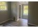 Spacious bedroom featuring LVP flooring, and ample light from the double windows at 5147 Highpoint Rd, Union City, GA 30291