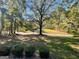 Well-maintained front yard featuring lush trees and shrubbery at 5147 Highpoint Rd, Union City, GA 30291