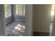 Bright living room area with many windows and luxury vinyl plank flooring at 5147 Highpoint Rd, Union City, GA 30291