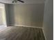 Open living room features new flooring, ceiling fan, and neutral wall color at 5147 Highpoint Rd, Union City, GA 30291