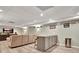 Finished basement featuring a comfortable seating area and wet bar with granite countertops at 100 Smokerise Trce, Peachtree City, GA 30269
