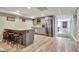 Finished basement with a kitchen area, stools, and granite countertops at 100 Smokerise Trce, Peachtree City, GA 30269