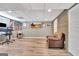 Finished basement featuring a workspace with a desk, chair, and a comfortable leather armchair at 100 Smokerise Trce, Peachtree City, GA 30269