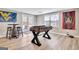 Finished basement with a foosball table, bar stools, and sports memorabilia decor at 100 Smokerise Trce, Peachtree City, GA 30269