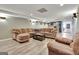 Finished basement with plenty of seating, recessed lighting and wood-look floors at 100 Smokerise Trce, Peachtree City, GA 30269