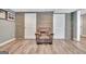 Cozy finished basement featuring a comfortable armchair and unique wood paneling at 100 Smokerise Trce, Peachtree City, GA 30269