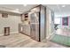 Finished basement showcases a kitchenette with a stainless steel refrigerator and wet bar area at 100 Smokerise Trce, Peachtree City, GA 30269