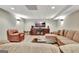 Finished basement with a large entertainment area featuring recessed lighting and modern decor at 100 Smokerise Trce, Peachtree City, GA 30269
