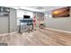 Finished basement offers a bright workspace featuring a desk, chair, window, and updated flooring at 100 Smokerise Trce, Peachtree City, GA 30269