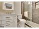 Modern bathroom features stylish vanity, tile flooring and glass enclosed shower at 100 Smokerise Trce, Peachtree City, GA 30269