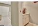 Bright bathroom featuring a vanity with a white cabinet and a decorative vase at 100 Smokerise Trce, Peachtree City, GA 30269