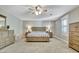 Large bedroom with carpet, ceiling fan, bed, dresser, and natural light at 100 Smokerise Trce, Peachtree City, GA 30269