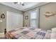 Bedroom with a closet, a window and a bed with a patterned quilt at 100 Smokerise Trce, Peachtree City, GA 30269
