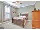 Bedroom with a wooden bed, a ceiling fan, a window and a wooden dresser at 100 Smokerise Trce, Peachtree City, GA 30269