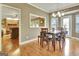 Inviting dining area with wood floors, chandelier and direct access to the outdoors at 100 Smokerise Trce, Peachtree City, GA 30269