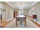 Traditional dining room featuring a large table and elegant chandelier at 100 Smokerise Trce, Peachtree City, GA 30269