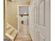 Hallway with wood-look flooring, staircase, and closet space at 100 Smokerise Trce, Peachtree City, GA 30269