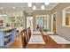 Eat-in kitchen featuring a center island, stainless appliances, and a dining area at 100 Smokerise Trce, Peachtree City, GA 30269