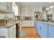 Charming kitchen with stainless steel appliances, granite counters, and hardwood floors at 100 Smokerise Trce, Peachtree City, GA 30269