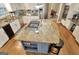 Overhead perspective of kitchen featuring a granite-topped island with gas range at 100 Smokerise Trce, Peachtree City, GA 30269