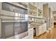 Kitchen featuring stainless steel oven, white cabinets, and ample counter space at 100 Smokerise Trce, Peachtree City, GA 30269