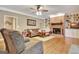 Comfortable living room with a brick fireplace and built-in shelving at 100 Smokerise Trce, Peachtree City, GA 30269