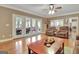 Inviting living room with hardwood floors and access to a covered deck at 100 Smokerise Trce, Peachtree City, GA 30269