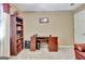 Cozy office area featuring shelving, desk, and carpeted floors at 100 Smokerise Trce, Peachtree City, GA 30269