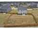 Aerial view of a spacious backyard with a wooden fence and a patio, perfect for outdoor activities at 517 Daffodil Ln, Mcdonough, GA 30253