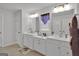 Spacious bathroom featuring double sinks, white cabinets, and ample counter space, perfect for a comfortable daily routine at 517 Daffodil Ln, Mcdonough, GA 30253