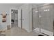 Well-appointed bathroom with a glass-enclosed shower and neutral tile, offering a clean and modern design at 517 Daffodil Ln, Mcdonough, GA 30253
