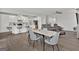 Open-concept kitchen and dining area with modern furnishings and a seamless flow at 517 Daffodil Ln, Mcdonough, GA 30253
