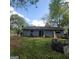 View of home's backyard with a patio and sliding glass door at 2884 Haddon Dr, Rex, GA 30273
