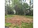 View of home's backyard with grass and trees at 2884 Haddon Dr, Rex, GA 30273