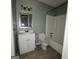Modest bathroom featuring a white vanity, a standard toilet, and a combined tub and shower unit at 2884 Haddon Dr, Rex, GA 30273