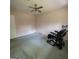 Bedroom features stained carpets and a ceiling fan with a power wheelchair at 2884 Haddon Dr, Rex, GA 30273