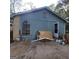 Shows the side exterior of the home with a mix of siding and brick at 2884 Haddon Dr, Rex, GA 30273