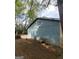 Side exterior view of a home showing simple siding and a glimpse of the yard at 2884 Haddon Dr, Rex, GA 30273