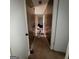 Hallway with wood paneling and stained carpet offers a glimpse into the home's layout at 2884 Haddon Dr, Rex, GA 30273