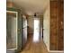 Hallway with wood-look flooring leading to the kitchen, laundry room and the back yard at 2884 Haddon Dr, Rex, GA 30273