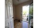A mud room that has wood-look floors and an exterior door that allows lots of natural light at 2884 Haddon Dr, Rex, GA 30273