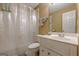 Cozy bathroom with a shower, toilet, and vanity sink at 7415 Northampton Ct, Cumming, GA 30040